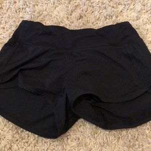 black lulu shorts size two w small hole details